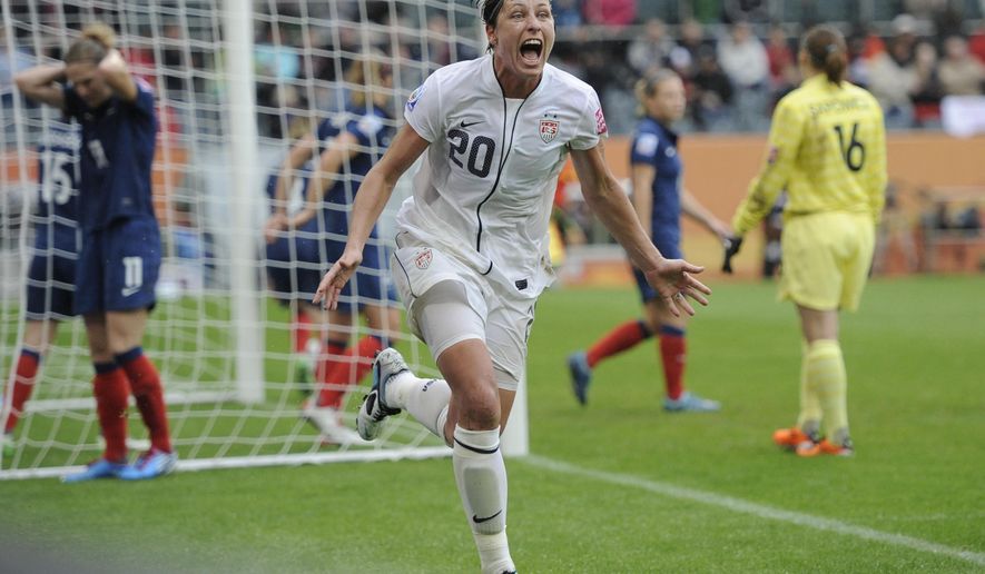 FILE - In this July 13, 2011, file photo, United States' Abby Wambach celebrates scoring her side's second goal during a semifinal match against France at the Women's Soccer World Cup in Moenchengladbach, Germany. Wambach is astonished when she reflects on the year she's had. She went from admitting a problem with alcohol and prescription pills to getting sober and marrying a "Christian mommy blogger." The biggest stunner? She doesn't miss soccer a bit.(AP Photo/Martin Meissner, File)