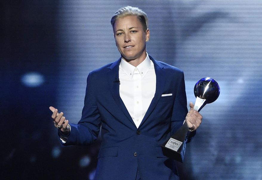 FILE - In this Wednesday, July 13, 2016, file photo, former soccer player Abby Wambach, accepts the icon award at the ESPY Awards at the Microsoft Theater in Los Angeles. Wambach is astonished when she reflects on her year. She went from publicly acknowledging a problem with alcohol and prescription pills to getting sober and marrying a "Christian mommy blogger." The biggest stunner? She doesn't miss soccer a bit. (Photo by Chris Pizzello/Invision/AP, File)