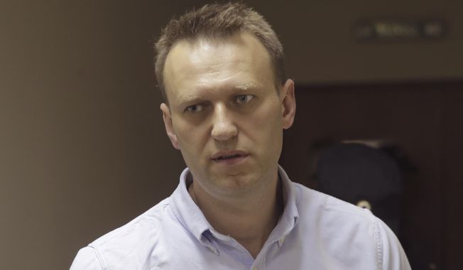 Russian opposition leader Alexei Navalny was arrested Monday on his way to a protest over accusations that Prime Minister Dmitry Medvedev had accepted over $1 billion in bribes from state banks and Kremlin-friendly oligarchs. (Associated Press)