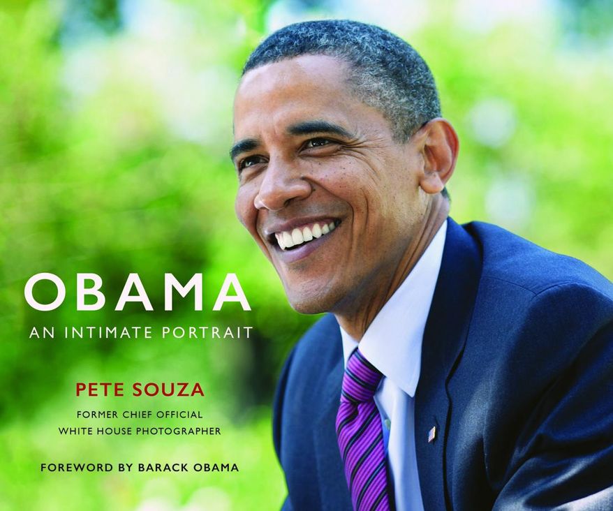This cover image released by  Little, Brown and Company shows &amp;quot;Obama: An Intimate Portrait,&amp;quot; by former White House photographer Pete Souza. ( Little, Brown and Company via AP)