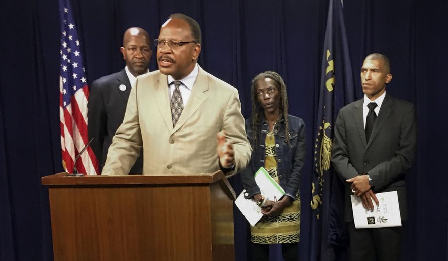 Presidents of the four branches in Oregon of the NAACP from left, Frederick Edwards, Corvallis branch; Benny Williams, at podium Salem-Keiser branch; Jo Anne Hardesty, Portland branch; and Eric Richardson, Eugene-Springfield branch attend a news conference Monday, June 12, 2017, at the state Capitol in Salem, Ore. The four came to State Capitol to support several bills, including one designed to end racial profiling by police, and to release a report that urges greater inclusiveness of minorities as the state turns to renewable energy. (AP Photo/Andrew Selsky)