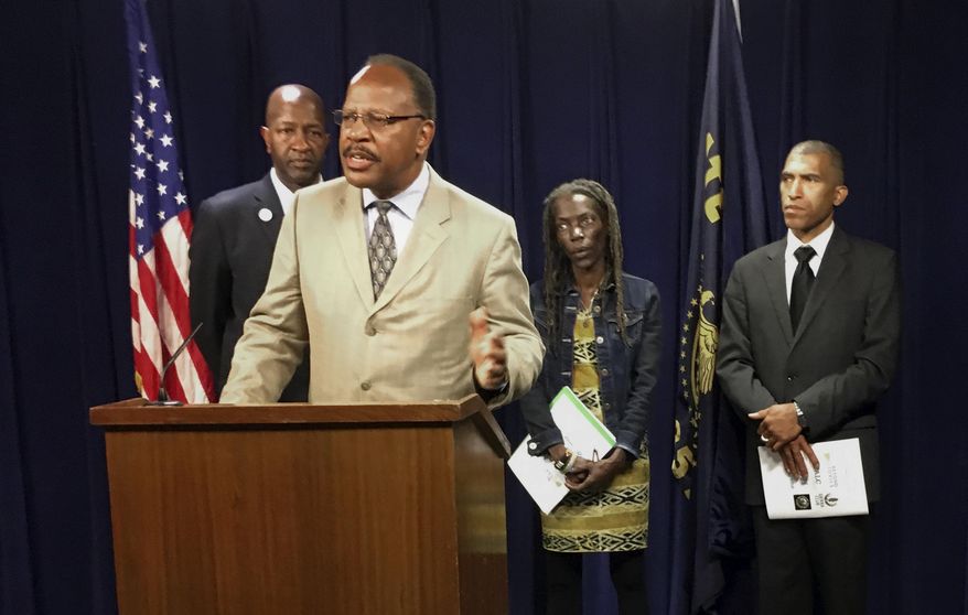Presidents of the four branches in Oregon of the NAACP from left, Frederick Edwards, Corvallis branch; Benny Williams, at podium Salem-Keiser branch; Jo Anne Hardesty, Portland branch; and Eric Richardson, Eugene-Springfield branch attend a news conference Monday, June 12, 2017, at the state Capitol in Salem, Ore. The four came to State Capitol to support several bills, including one designed to end racial profiling by police, and to release a report that urges greater inclusiveness of minorities as the state turns to renewable energy. (AP Photo/Andrew Selsky)