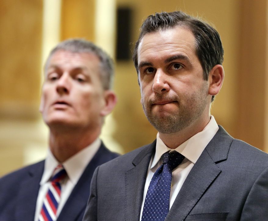 Jersey City Public Safety Director James Shea, left, and Mayor Steven Fulop take questions from journalists during a news conference in Jersey City, N.J., Monday, June 12, 2017. The officials announced some suspensions after video showed police kicking a man and dragging him into a roadway after a fiery crash. (AP Photo/Seth Wenig)