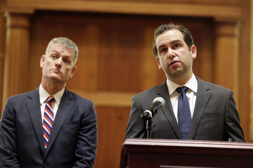 Jersey City Public Safety Director James Shea, left, and Mayor Steven Fulop take questions from journalists during a news conference in Jersey City, N.J., Monday, June 12, 2017. The officials announced some suspensions after video showed police kicking a man and dragging him into a roadway after a fiery crash. (AP Photo/Seth Wenig)