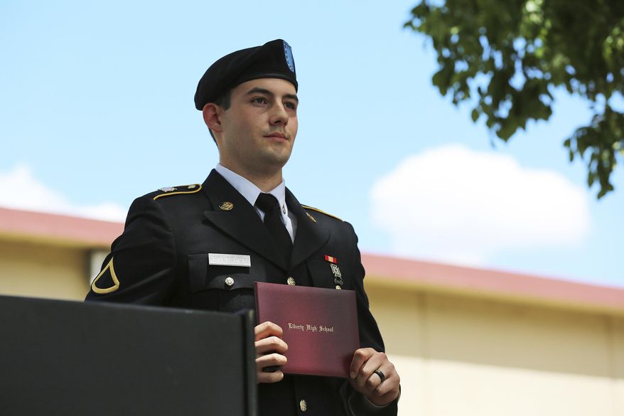 Army reservist Harland Fletcher displays his high school diploma during a private graduation ceremony Monday, June 12, 2017, in Brentwood, Calif. The Liberty High School principal held the ceremony as an apology for not allowing Fletcher to wear his military uniform during his graduation last Friday. (AP Photo/Linda Wang)