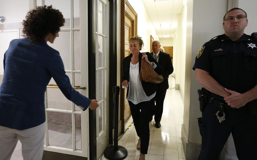 Andrea Constand, left, waits for her mother, Gianna Constand, center, outside the courtroom after closing arguments in Bill Cosby's sexual assault trial at the Montgomery County Courthouse in Norristown, Pa., Monday, June 12, 2017. Both women testified in the trial. (David Maialetti/The Philadelphia Inquirer via AP, Pool)