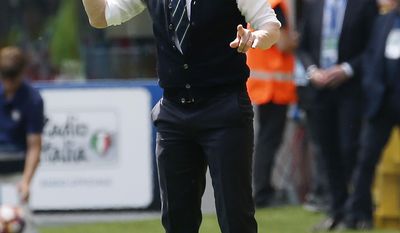 FILE -  In this Sunday, May 14, 2017 file photo coach Eusebio Di Francesco gives instructions during the Serie A soccer match between Inter Milan and Sassuolo at the San Siro stadium in Milan, Italy. Former Sassuolo coach Eusebio Di Francesco has been named manager of Serie A runner-up Roma, Tuesday, June 13, 2017 marking a return to the club where he used to play as a midfielder. (AP Photo/Antonio Calanni, file)