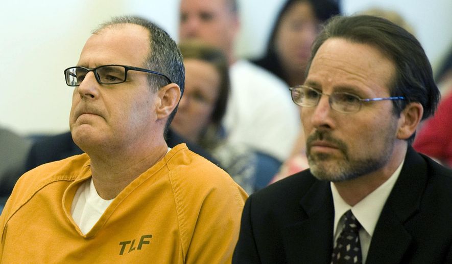 FILE - This May 2, 2014 file photo shows Scott Dekraai, left, sitting with his public defender Scott Sanders in Orange County Superior Court in Santa Ana, Calif., waiting for a ruling over over allegations of prosecutorial misconduct and misuse of jailhouse informants. A grand jury will release findings Tuesday, June 13, 2017, from an investigation into the use of jailhouse informants in Orange County amid a long-running scandal over the use of the snitches. (Kevin Sullivan/The Orange County Register via AP, File)