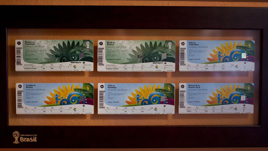 In this May 24, 2017 photo, tickets for Mexico matches for the 2014 Brazil World Cup are displayed inside the home of Gabriel Galvan, a founding member of "La Ola Verde," or The Green Wave in Mexico City. Galvan has seen more than 100 of his team's matches, and Russia will be his 36th country. (AP Photo/Eduardo Verdugo)
