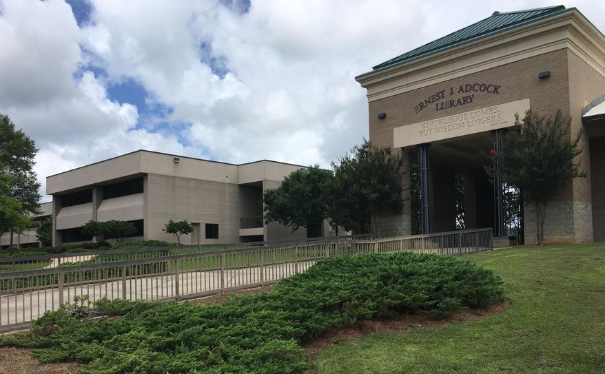 The exterior of the library, right, and a classroom building are shown on Tuesday, June 13, 2017, at Holmes Community College in Ridgeland, Mississippi. The state’s 15 public community and junior colleges are raising tuition by 13 percent, on average, for the school year beginning fall 2017, partly in reaction to budget cuts by the state Legislature. (AP Photo/Jeff Amy)