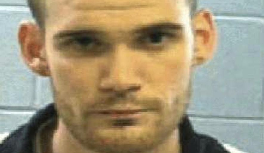 This undated photo released by the Georgia Department of Corrections Tuesday, June 13, 2017, shows inmate Ricky Dubose. Authorities say Dubose and inmate Donnie Russell Rowe escaped after killing two prison guards during a bus transport in Georgia. Both are being sought by law enforcement. (Georgia Department of Law Enforcement via AP)