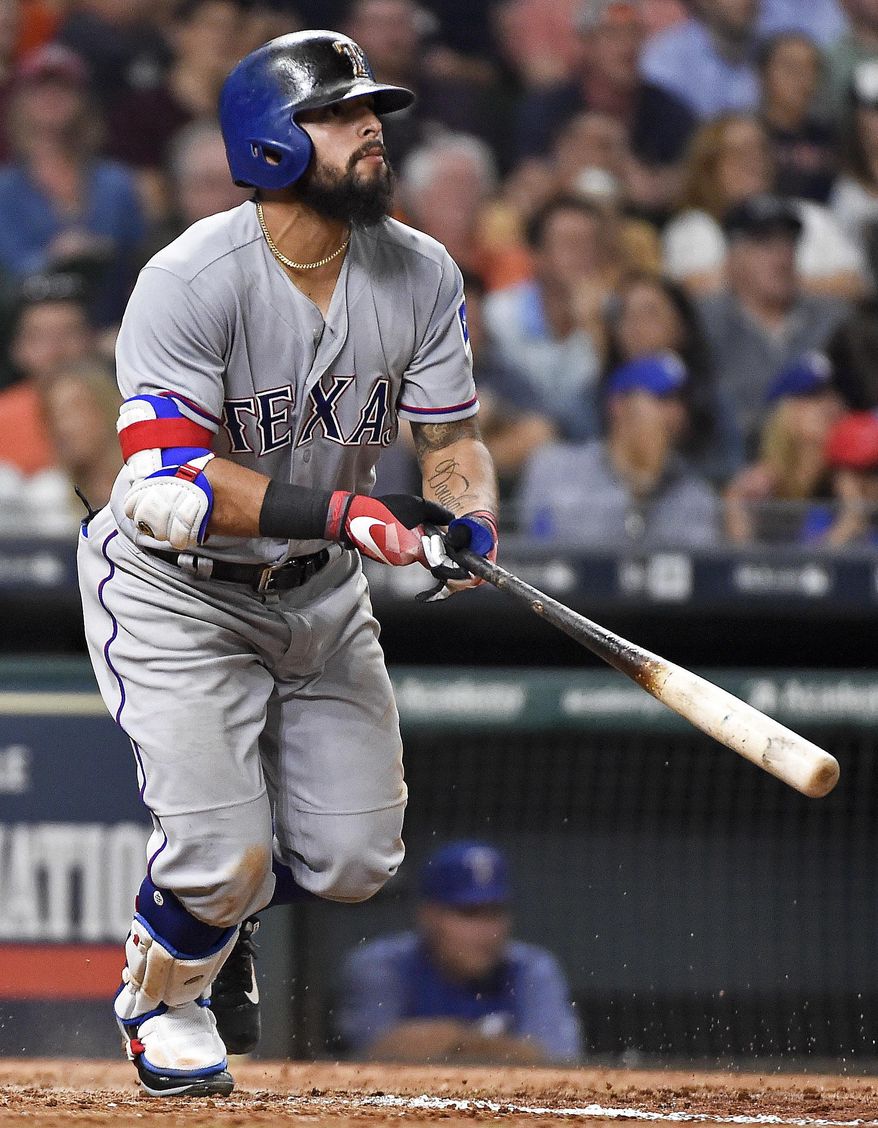 Texas Rangers' Rougned Odor watches his solo home run off Houston Astros relief pitcher Chris Devenski during the seventh inning of a baseball game, Tuesday, June 13, 2017, in Houston. (AP Photo/Eric Christian Smith)