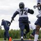Seattle Seahawks defensive end Michael Bennett runs an agility drill during NFL football practice, Tuesday, June 13, 2017, in Renton, Wash. (AP Photo/Ted S. Warren)