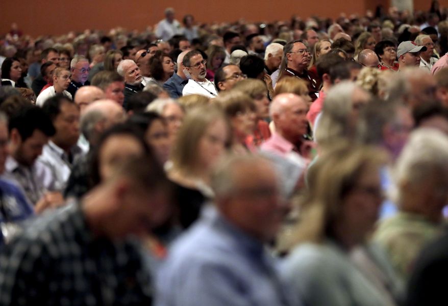 People attend the Southern Baptist Convention annual meeting, Tuesday, June 13, 2017, in Phoenix. (AP Photo/Matt York)