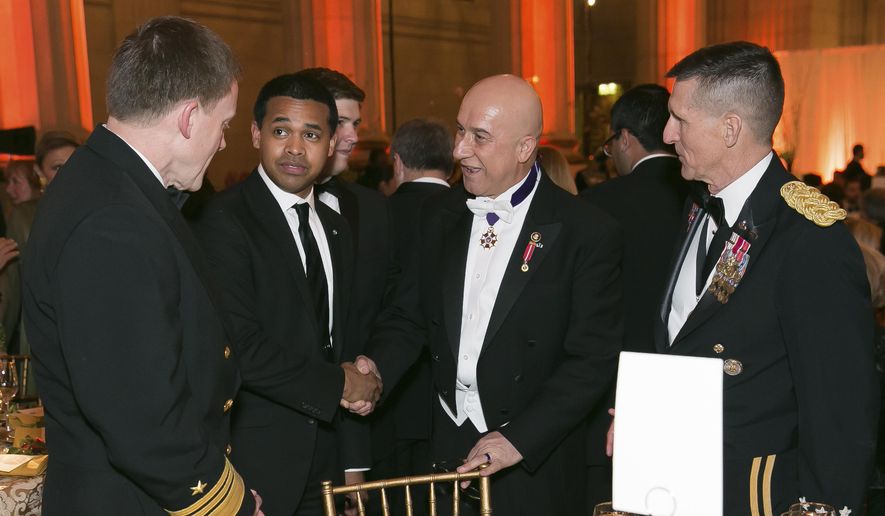 In this March 15, 2014, file photo provided by Alfredo Flores, from left, Vice Admiral Michael Rogers; Paul Monteiro, vice chairman and co-Founder of Nowruz Commission; Bijan R. Kian and Lt. Gen. Michael Flynn talk during the Fifth Annual Nowruz Commission Gala at the Andrew W. Mellon Auditorium in Washington. (Alfredo Flores via AP) ** FILE **