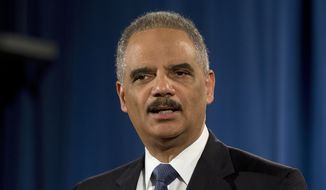 Then-Attorney General Eric Holder speaks at the Justice Department in Washington, in this March 4, 2015, photo. (AP Photo/Carolyn Kaster)