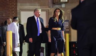 President Donald Trump and first lady Melania Trump walk to their vehicle after visiting MedStar Washington Hospital Center in Washington, Wednesday, June 14, 2017, where House Majority Leader Steve Scalise of La. was taken after being shot in Alexandria, Va., during a Congressional baseball practice. (AP Photo/Pablo Martinez Monsivais)