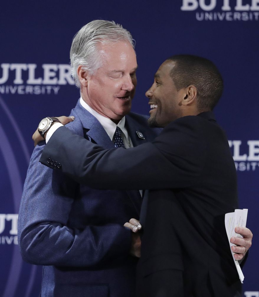 Butler athletic director Barry Collier, left, congratulates LaVall Jordan during an NCAA college basketball news conference introducing Jordan as the new men's head basketball coach at Butler, Wednesday, June 14, 2017, in Indianapolis. (AP Photo/Darron Cummings)