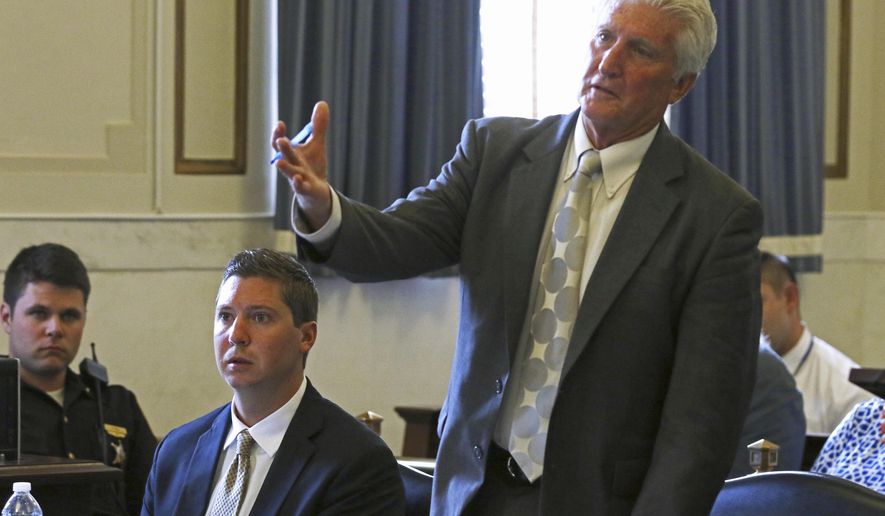Former University of Cincinnati officer Ray Tensing , second from left, watches as his attorney Stewart Mathews, right, speaks during testimony in Tensing's retrial Tuesday, June 13, 2017, in the Hamilton County Courthouse in Cincinnati. Tensing is charged with murder and voluntary manslaughter in the shooting of unarmed black motorist Sam DuBose during a July 19, 2015, traffic stop. (Cara Owsley/The Cincinnati Enquirer via AP, Pool)