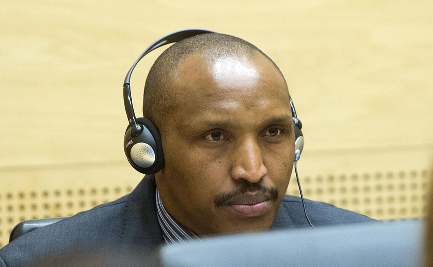 FILE - A Monday Feb. 10, 2014 file photo of Bosco Ntaganda awaiting the start of a hearing at the International Criminal Court (ICC) in The Hague, Netherlands. Bosco Ntaganda, an ethnic Tutsi from Rwanda, briefly took the stand Wednesday afternoon, June 14, 2017, at the start of weeks of questioning by his defense lawyer and cross-examination by prosecutors. (AP Photo/Toussaint Kluiters, Pool, File)