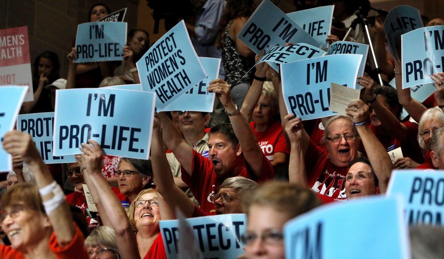 People cheer during an anti abortion rally in the Statehouse in Jefferson City, Mo., Wednesday, June 14, 2017. Missouri Republican Gov. Eric Greitens is leading a Capitol rally to show support for a special session he called on abortion. (David Carson/St. Louis Post-Dispatch via AP) ** FILE **