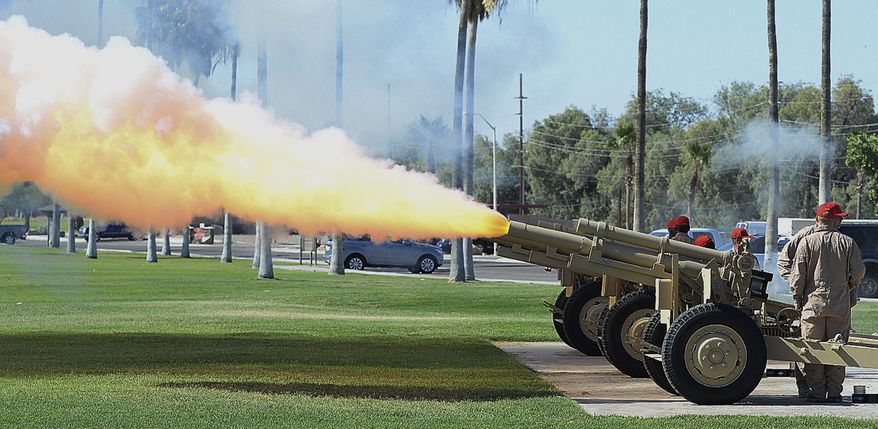 Members of the Weapons Operations Division Salute Battery fire howitzers during a Change of Command ceremony at YPG, 25 miles north of Yuma, Ariz., Thursday, June 15, 2017. Matthews replaces outgoing YTC commander Lt. Col. James DeBoer. Yuma Proving Ground is a U.S. Army facility and one of the largest military installations in the world. (Randy Hoeft/The Yuma Sun via AP)