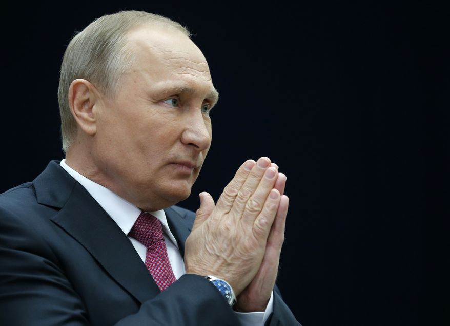Russian President Vladimir Putin gestures speaking to the media after his annual live call-in show in Moscow, Russia, Thursday, June 15, 2017. President Vladimir Putin said Russia will pour resources into the development of its vast Arctic region for both economic and military reasons. (AP Photo/Alexander Zemlianichenko)