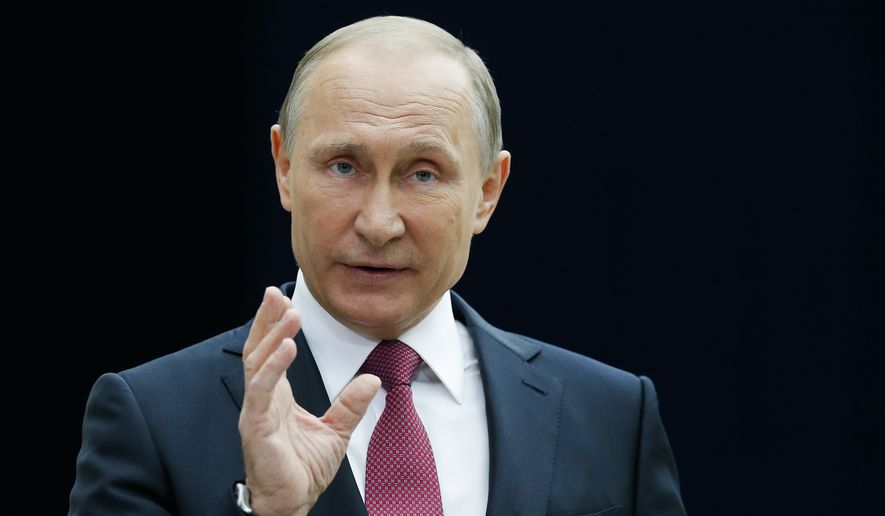 Russian President Vladimir Putin gestures while speaking to the media after his annual televised call-in show in Moscow, Russia, Thursday, June 15, 2017. Putin has his annual live call-in show, a TV marathon lasting for hours in which he may for the first time declare his intention to seek another term in 2018, comment on the latest opposition protest and talk about Russia-U.S. ties and other issues. (AP Photo/Alexander Zemlianichenko) ** FILE **