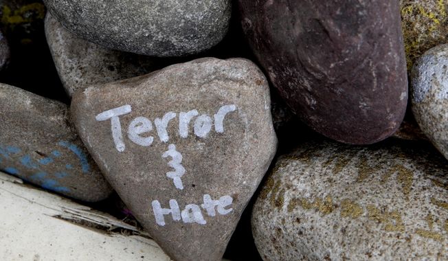 A rock has the words &amp;quot;terror and hate&amp;quot; written on it at an art installation that encourages the public to write out their fears and leave them behind, along Mt. Vernon Ave in Alexandria, Va., Thursday, June 15, 2017, the day after House Majority Whip Steve Scalise of La. was shot during during a congressional baseball practice. (AP Photo/Jacquelyn Martin)