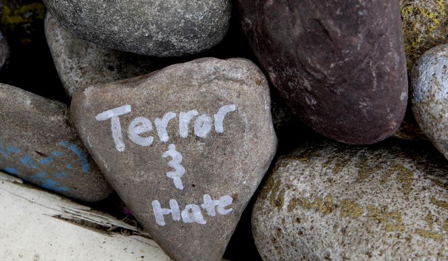 A rock has the words &amp;quot;terror and hate&amp;quot; written on it at an art installation that encourages the public to write out their fears and leave them behind, along Mt. Vernon Ave in Alexandria, Va., Thursday, June 15, 2017, the day after House Majority Whip Steve Scalise of La. was shot during during a congressional baseball practice. (AP Photo/Jacquelyn Martin)