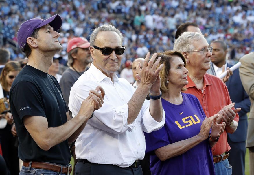 Speaker Paul Ryan of Wis., left, Senate Minority Leader Chuck Schumer of N.Y., House Minority Leader Nancy Pelosi of Calif., and Senate Majority Leader Mitch McConnell of Ky., applaud a message by President Donald Trump on the video board, before the congressional baseball game, Thursday, June 15, 2017, in Washington. The annual GOP-Democrats baseball game raises money for charity. (AP Photo/Alex Brandon) ** FILE **