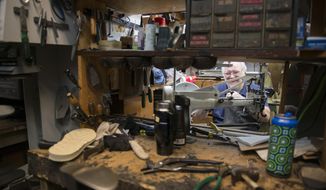 ADVANCE FOR USE SATURDAY, JUNE 17, 2017, AND THEREAFTER- In this May 7, 2017, photo, owner of Fast Eddie&#39;s Place Jim Picard works on a shoe inside his repair shop in Minneapolis. (Alex Tuthill-Preus/The Minnesota Daily via AP)