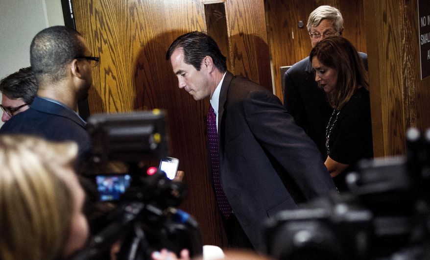 Nick Lyon, Michigan Department of Health and Human Services director, walks out of the courtroom after his release on a cash bond following his arraignment on Thursday, June 15, 2017 at Genesee District Court in downtown Flint. Lyon is charged with misconduct in office for allegedly obstructing university researchers who are studying if the surge in cases was linked to the Flint River. (Jake May/The Flint Journal-MLive.com via AP)