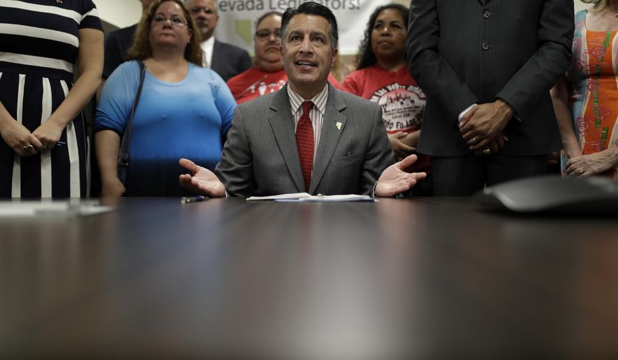 Nevada Gov. Brian Sandoval speaks before signing Senate Bill 539 during a signing ceremony Thursday, June 15, 2017, in North Las Vegas, Nev. The bill aims to force America&#39;s three insulin manufacturers to annually turn over the prices they set and profits they make on insulin. (AP Photo/John Locher)