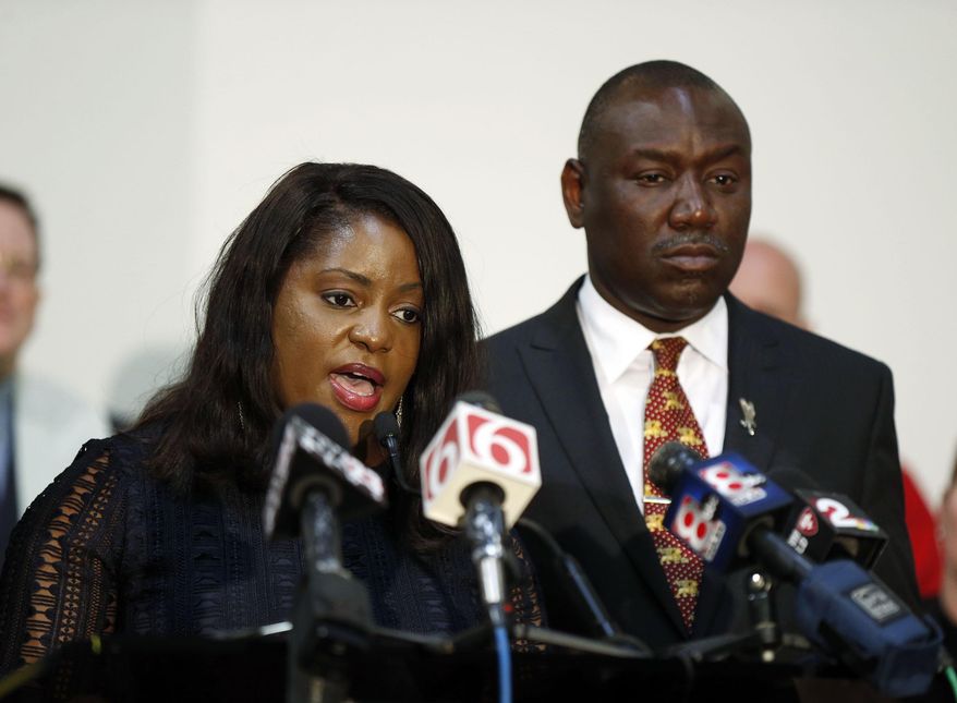 FILE- In this May 18, 2017, file photo, Tiffany Crutcher, sister of Terence Crutcher, and Benjamin Crump speak during a press conference in Tulsa, Okla., after a not guilty verdict in the manslaughter trial of Betty Shelby, a white Oklahoma police officer who fatally shot Terence Crutcher, an unarmed black man. The family of Terence Crutcher filed a wrongful death lawsuit in federal court Thursday, June 15, against the city of Tulsa and the policewoman, who was acquitted of manslaughter charges last month. (Stephen Pingry/Tulsa World via AP, File)