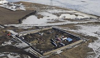 FILE- This Feb. 13, 2017, file aerial photo shows a site where the final phase of the Dakota Access Pipeline will take place with boring equipment routing the pipeline underground and across Lake Oahe to connect with the existing pipeline in Emmons County in Cannon Ball, N.D. A federal judge has handed a lifeline to efforts to block the pipeline, ruling Wednesday June 14, that the U.S. Army Corps of Engineers didn&#39;t adequately consider the possible impacts of an oil spill where the pipeline passes under the Missouri River. (Tom Stromme /The Bismarck Tribune via AP, File)