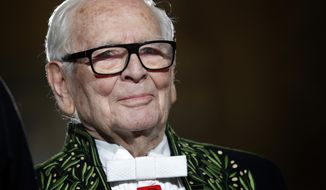 FILE - In this Nov. 30, 2016, file photo, French fashion designer Pierre Cardin acknowledges applause after a show to mark 70 years of his creations, in Paris. Cardin said he won’t be able to attend a fashion show in the United States because of an unspecified accident. The 94-year-old designer was scheduled to host the show in Newport, R.I, on Saturday, June 17, 2017, to celebrate an exhibition of his designs. (AP Photo/Christophe Ena, File)