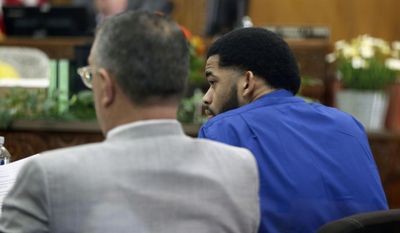 Milwaukee police Dominique Heaggan-Brown, right, sits with Attorney Steven R. Kohn, during Heaggan-Brown's trail in Milwaukee on Wednesday, June 14, 2017. Jurors in Heaggan-Brown's trial who is charged with killing a black man fleeing a traffic stop were expected Wednesday to see footage of the shooting from an officer's body camera. (Michael Sears/Milwaukee Journal-Sentinel via AP, Pool)