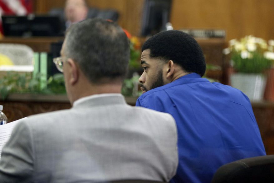 Milwaukee police Dominique Heaggan-Brown, right, sits with Attorney Steven R. Kohn, during Heaggan-Brown's trail in Milwaukee on Wednesday, June 14, 2017. Jurors in Heaggan-Brown's trial who is charged with killing a black man fleeing a traffic stop were expected Wednesday to see footage of the shooting from an officer's body camera. (Michael Sears/Milwaukee Journal-Sentinel via AP, Pool)