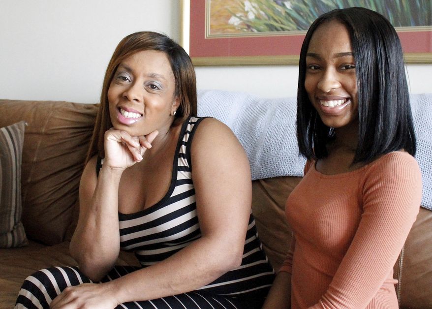 Iisha Brown, left, and her daughter, Olivia Brown, 17, pose for a photo in their Charlotte living room Thursday, June 1, 2017 in Charlotte, N.C. Because Olivia Brown lives in North Carolina, she was charged as an adult for a school fight last year, and now worries that with a criminal record, her chance at a successful life is ruined, Since 1919, North Carolina has treated teens over the age of 15 as adults in its courts system. Now, state legislators are looking at a measure to raise the age of juvenile jurisdiction to include 16- and 17-year-olds, like in 44 other states, according to the National Conference of State Legislators' website. (AP Photo/Christina Sandidge)