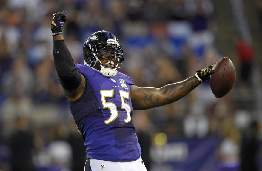 FILE - In this Aug. 29, 2015, file photo, Baltimore Ravens outside linebacker Terrell Suggs celebrates after intercepting a pass attempt by Washington Redskins quarterback Kirk Cousins during a preseason NFL football game in Baltimore. Don&#x27;t let Suggs&#x27; mischievous smile and devil-may-care demeanor fool you. Underneath all that is a serious football player, one who stands out as the unquestioned leader of the Ravens defense. (AP Photo/Nick Wass, File)