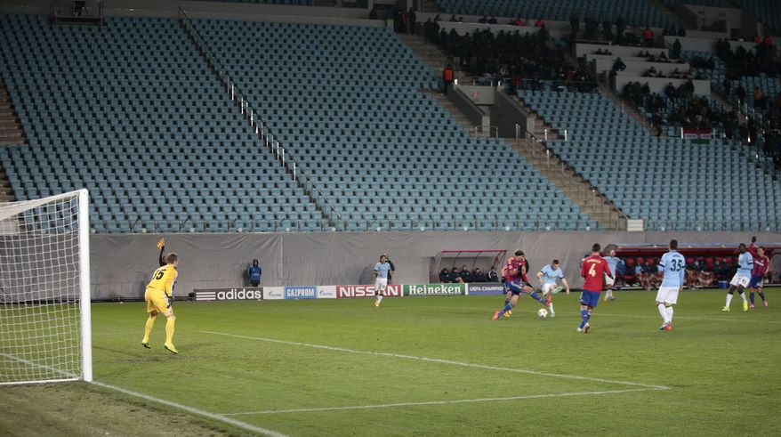 In this Tuesday, Oct. 21, 2014, file photo, Manchester City players and CSKA players play in front of empty stands during the Champions League Group E soccer match between CSKA Moscow and Manchester City at Arena Khimki stadium in Moscow. CSKA had to play 3 matches behind closed doors after as punishment for the bad behaviour of their fans. A new report seen by the Associated Press shows Russia has made progress fighting football racism ahead of the Confederations Cup and next year's World Cup, but warns that anti-Semitism in stadiums has grown and that racist fans are using far-right codes to smuggle offensive messages into stadiums. (AP Photo/Ivan Sekretarev, File)