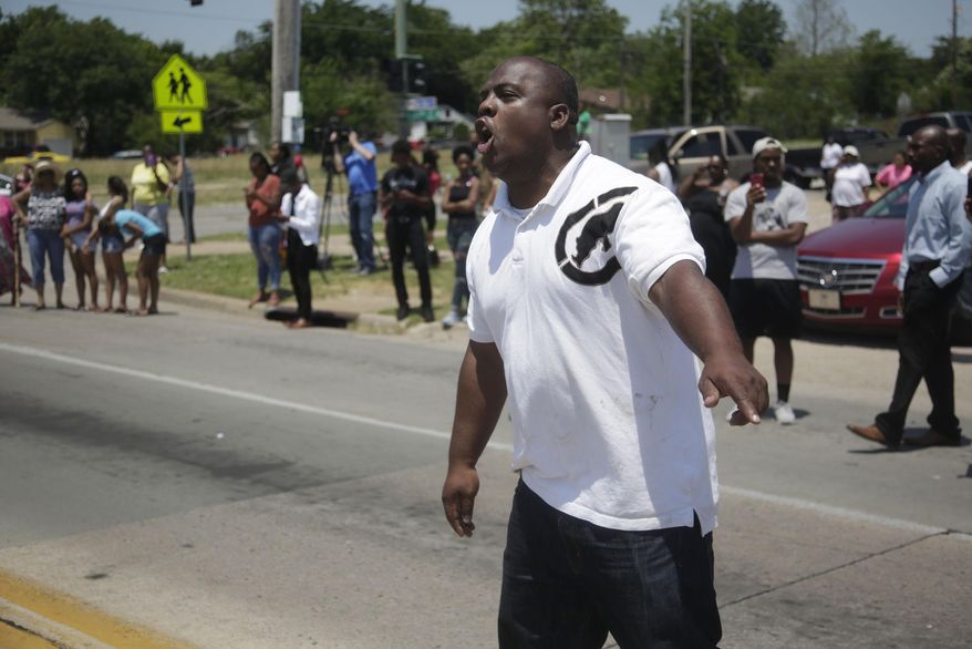 FILE - In this Friday, June 9, 2017 file photo, Tim Borrens yells at police after a man was fatally shot in Tulsa, Okla. Police in Oklahoma say an officer involved in the fatal shooting of a black man turned on his body camera seconds after shots were fired. (Mike Simons/Tulsa World via AP, File)