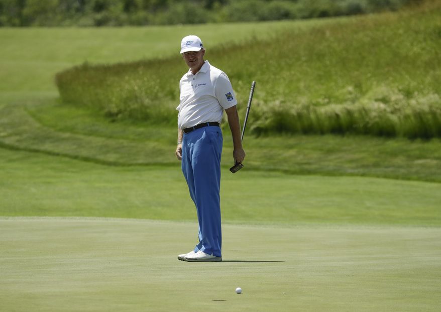 Ernie Els, of South Africa, putts on the 17th hole during the first round of the U.S. Open golf tournament Thursday, June 15, 2017, at Erin Hills in Erin, Wis. (AP Photo/Charlie Riedel)
