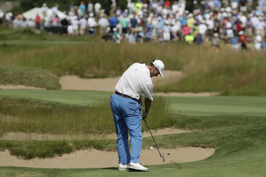 Ernie Els, of South Africa, hits on the seventh hole during the first round of the U.S. Open golf tournament Thursday, June 15, 2017, at Erin Hills in Erin, Wis. (AP Photo/Charlie Riedel)