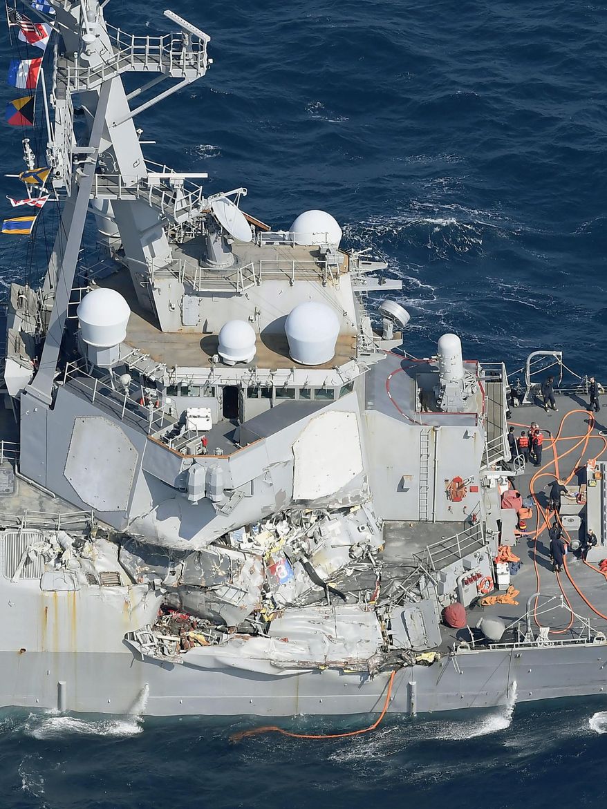 CORRECTS DATE - The damage of the right side of the USS Fitzgerald is seen off Shimoda, Shizuoka prefecture, Japan, after the Navy destroyer collided with a merchant ship, Saturday, June 17, 2017. The U.S. Navy says the USS Fitzgerald suffered damage below the water line on its starboard side after it collided with a Philippine-flagged merchant ship. (Iori Sagisawa/Kyodo News via AP)