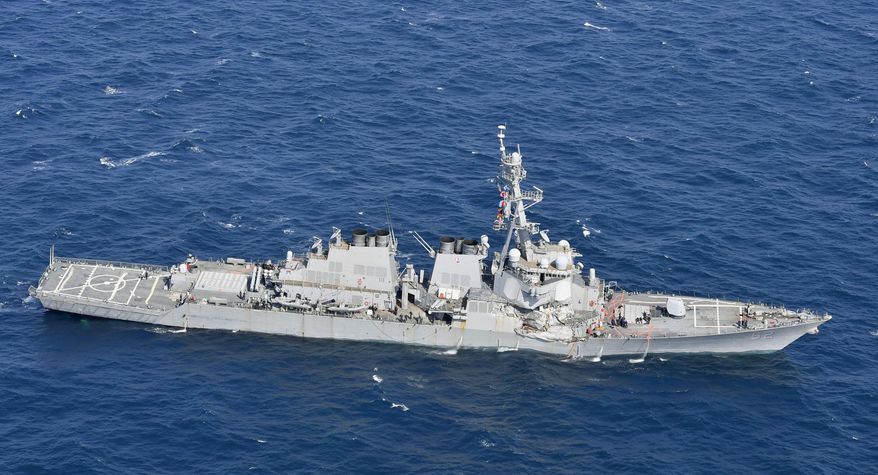 CORRECTS DATE - The USS Fitzgerald is seen off Shimoda, Shizuoka prefecture, Japan, after the Navy destroyer collided with a merchant ship, Saturday, June 17, 2017. The U.S. Navy says the USS Fitzgerald suffered damage below the water line on its starboard side after it collided with a Philippine-flagged merchant ship. (Iori Sagisawa/Kyodo News via AP)