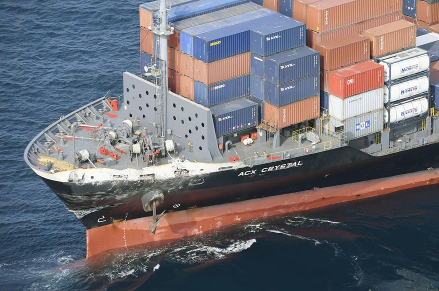 CORRECTS DATE - The damage of Philippine-registered container ship ACX Crystal is seen off Izu Oshima, Japan, after it had collided with the USS Fitzgerald southwest of Yokusuka, Japan, Saturday, June 17, 2017. The U.S. Navy says the USS Fitzgerald suffered damage below the water line on its starboard side after it collided with the Philippine-flagged merchant ship. (Iori Sagisawa/Kyodo News via AP)