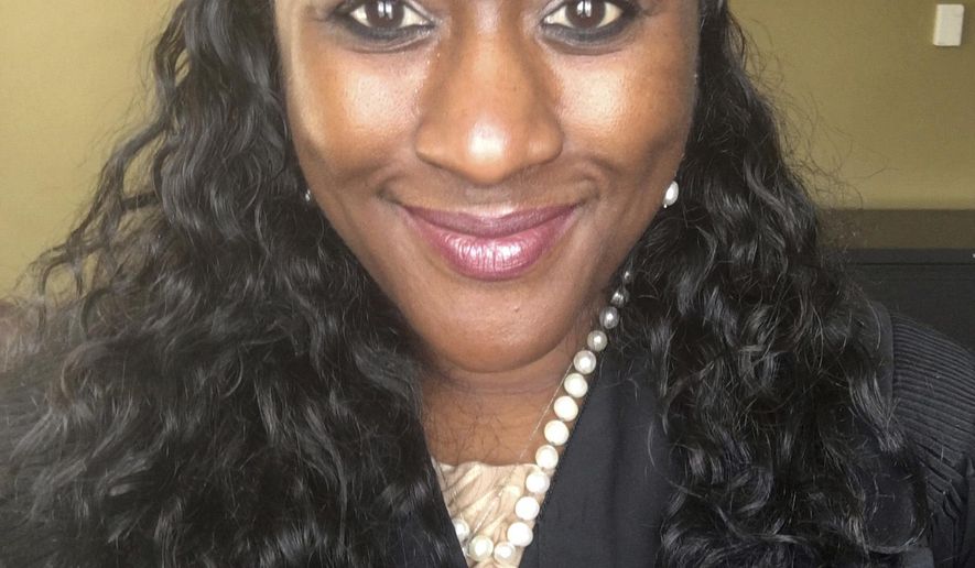 In this April 22, 2016 provided by Gay Polk-Payton, Forrest County Justice Court Judge Gay Polk-Payton smiles for a selfie in judicial robes in Hattiesburg, Miss. Two days after hearing arguments, the Mississippi Supreme Court dismissed a complaint filed against Polk-Payton by the state Commission on Judicial Performance seeking to reprimand her, saying she had used her job on the bench and the online persona to promote herself as a motivational speaker and musical entertainer. (Gay Polk Payton, via AP)
