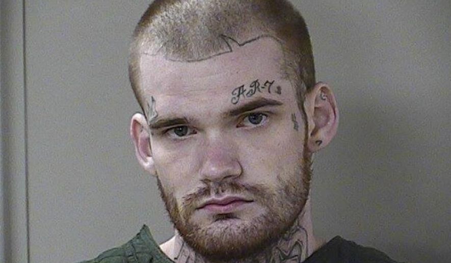 In this June 15, 2017 photo released by the Rutherford County Sheriff's Office, escaped Georgia inmate Ricky Dubose poses for a booking photo in Tenn. The end of the road for the two inmates, Dubose, and Donnie Russell Rowe sought in the killings of their guards on a Georgia prison bus turned out to be the driveway of a homeowner in rural Tennessee, who held them at gunpoint, June 15, 2017, until reinforcements arrived. (Rutherford County Sheriff's Office via AP)